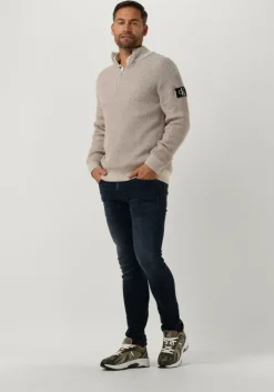 beige calvin klein trui badge plated half zip sweater