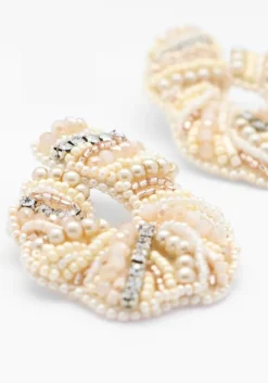 beige paulie pocket oorbellen glamorous curl earrings