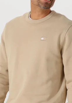 beige tommy jeans sweater tjm reg badge crew ext
