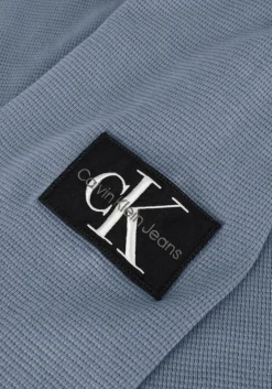 blauwe calvin klein trui washed badge waffle