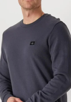 blauwe calvin klein trui woven label waffle ls tee