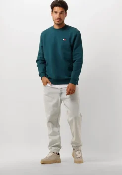 blauwe tommy jeans sweater tjm reg badge crew ext