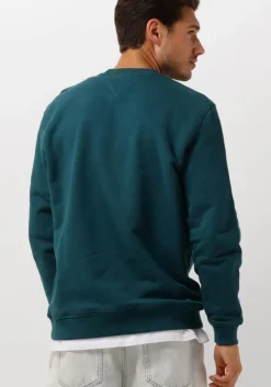 blauwe tommy jeans sweater tjm reg badge crew ext