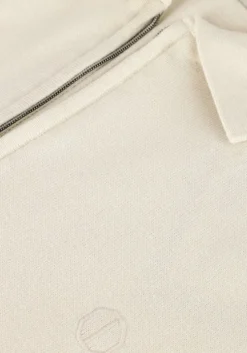 creme dstrezzed polo dorian zip polo