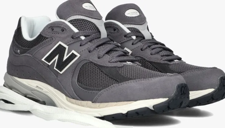 grijze new balance lage sneakers m2002 m