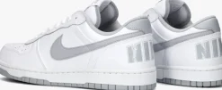 grijze nike lage sneakers big nike low