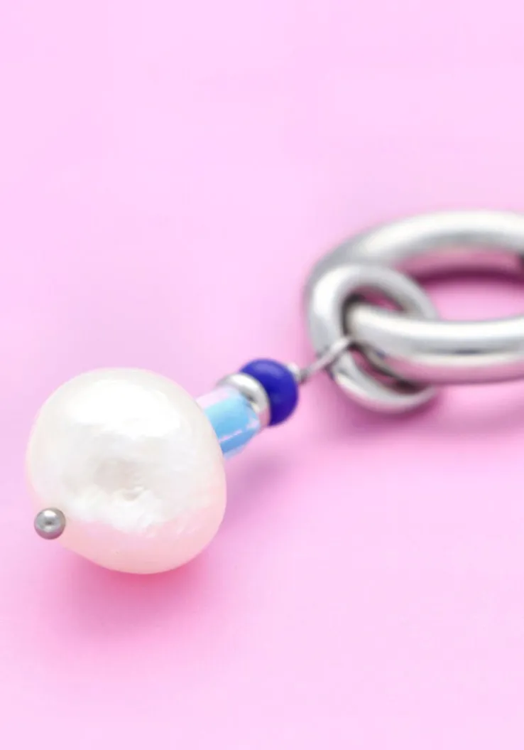 zilverkleurig notre-v oorbellen ss23 earring new collection